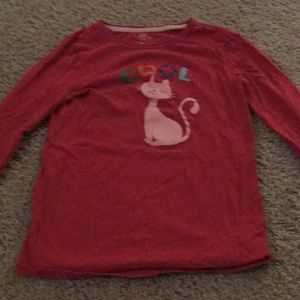 A red pink shirt with the word cool on it.